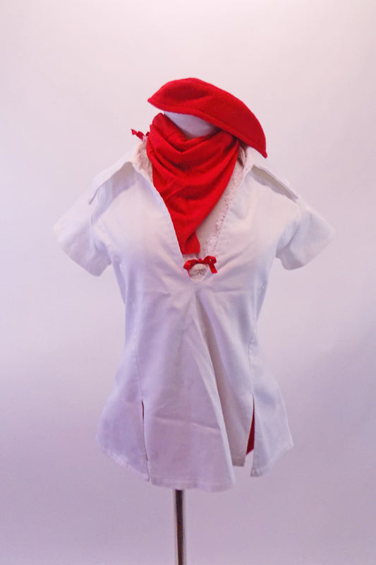 Scrubs themed white tunic top has open V-neck and collar. The back right has a large red crystalled heart. Beneath the tunic is a white lace halter bra with red bow accent and red V-front bootie shorts. Comes with red Juliet hat and matching scarf. Front