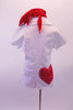 Scrubs themed white tunic top has open V-neck and collar. The back right has a large red crystalled heart. Beneath the tunic is a white lace halter bra with red bow accent and red V-front bootie shorts. Comes with red Juliet hat and matching scarf. Back