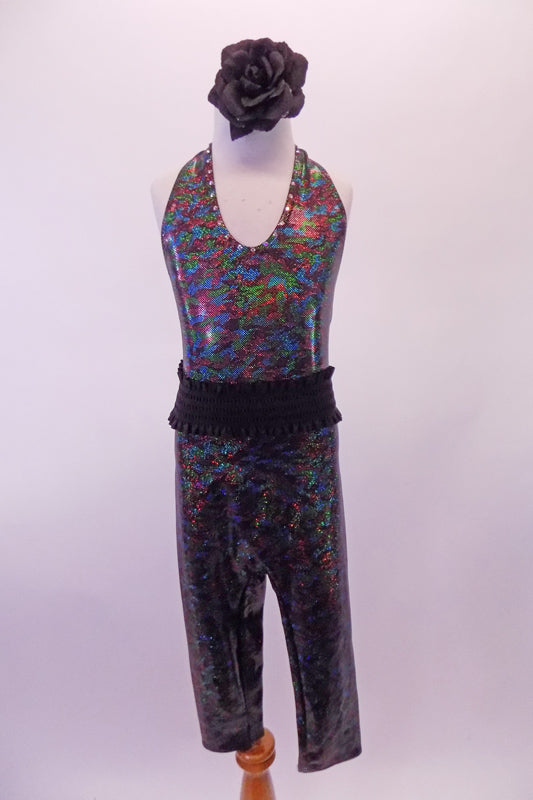 V-neck halter-neck unitard is an iridescent black speckle print with capri-length pant and open back. Comes with gathered wide, black, elastic belt and black floral hair accessory. Front