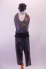 V-neck halter-neck unitard is an iridescent black speckle print with capri-length pant and open back. Comes with gathered wide, black, elastic belt and black floral hair accessory. Front