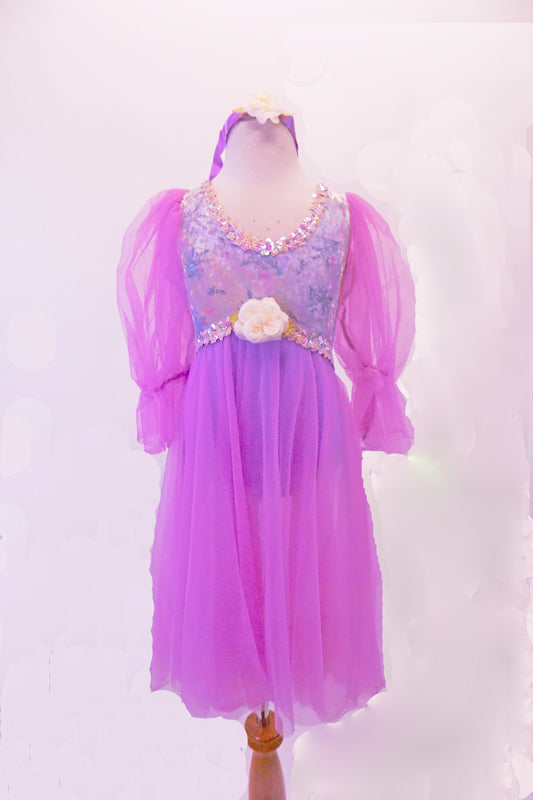 Lavender leotard-based Empire dress has a floral print bodice with silver sequined trim. Large pouffe and ruffled sheer sleeves and attached knee-length skirt give the dress a pretty flow on stage. The bodice has large ivory rose accent and a matching floral and ribbon headband. Front