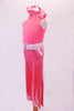 Coral crystalled tank top with scoop back is accompanied by coral shimmery pants. A white leatherette laser cut lace belt and matching wristbands accent the outfit. Comes with matching hair scarf. Side