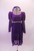 Purple medieval style dress has a silver diamond pattern on the velvet bodice and pouffe long sleeves. The purple knee length cotton skirt falls straight Comes with velvet wreath hair accessory. Front