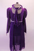 Purple medieval style dress has a silver diamond pattern on the velvet bodice and pouffe long sleeves. The purple knee length cotton skirt falls straight Comes with velvet wreath hair accessory. Back