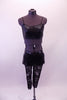 Three-piece black costume has a black shimmery bra top with matching “v” waist bootie shorts. The sheer ¾ length back leggings are made torn for the effect Comes with a black hair accessory. Front