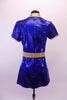 Royal blue shimmery tunic style short V-neck dress with side slits, has a gold lapel collar and matching gold belt. Comes with matching brief and hair accessory. Back