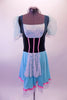 Ballet costume has teal velvet bodice with white lace bust and apron. The sheer aqua pouffe sleeves complement the aqua skirt. Pink ribbon detail accents the bodice and skirt edge. Wide white lace trim edges the skirt and sleeves. Comes with a white floral wreath accessory. Front
