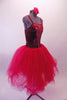 Crimson red romantic tutu has long tulle skirt with a crushed velvet bodice. The front center of the torso is red sequin with a large red jewel brooch accent. The back has a nude panel with faux corset ties. Comes with a floral hair accessory. Side