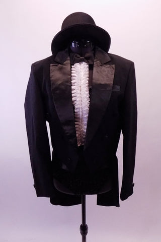Black sequined leotard with cummerbund waistband. Has a bowtie collar with a ruffled white pleated accent. Comes with satin-lapeled tuxedo tailcoat and top hat. Front