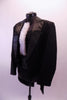 Black sequined leotard with cummerbund waistband. Has a bowtie collar with a ruffled white pleated accent. Comes with satin-lapeled tuxedo tailcoat and top hat. Side