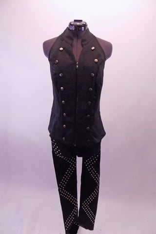 Bad girl style black studded zip front halter vest has a gathered elastic back that flares out slightly at the hips. Comes with black leggings with a zig-zag studded design pattern on the leg. Front