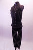 Bad girl style black studded zip front halter vest has a gathered elastic back that flares out slightly at the hips. Comes with black leggings with a zig-zag studded design pattern on the leg. Side