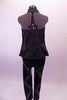 Bad girl style black studded zip front halter vest has a gathered elastic back that flares out slightly at the hips. Comes with black leggings with a zig-zag studded design pattern on the leg. Back