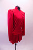 Red coat style uniform themed dress has a partial mandarin collar. Two large silver buckles adorn the left side of the dress at the bust and hip. The box pleat straight short skirt has a slit at the left side. Right side