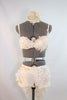 Custom designed, ivory bra, and shorts with intricate appliqué, beading, feathers, and  crystals. Back has tail of layered tulle, crystals and rose fabric, front