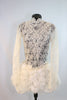 Custom, ivory lace long sleeved dress has open back lined with thick beaded bridal appliqué. Skirt is layers of tulle and silk rose fabric. covered crystals. Front