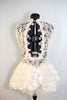 Custom, ivory lace long sleeved dress has open back lined with thick beaded bridal appliqué. Skirt is layers of tulle and silk rose fabric. covered crystals. Back 