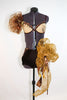 Caramel bra, brown velvet piping and flowers. Gold organza pouf on right shoulder. Shorts are brown velvet with crystal detail, large bow/pouf on the right hip, front