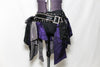 2 piece costume is comprised of a pleather bra with front cross straps Shoulder and hip  have layers for purple/grey/ black taffeta & crystal covered hip-belt. Front bottom zoom