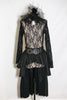 Long sleeved, black, open backed lace bodysuit with crystals throughout. Attached high tulle collar with vintage lace and a cameo & leathery, ruffled skirt, front