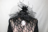 Long sleeved, black, open backed lace bodysuit with crystals throughout. Attached high tulle collar with vintage lace and a cameo & leathery, ruffled skirt, front zoom