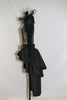 Long sleeved, black, open backed lace bodysuit with crystals throughout. Attached high tulle collar with vintage lace and a cameo & leathery, ruffled skirt, side