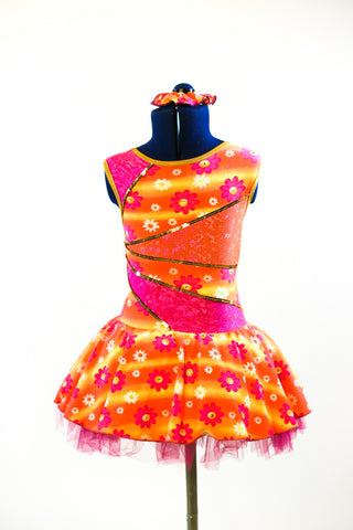 Dress has a wave of orange and yellow with white/pink flowers with crystal centers, front