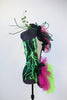 Green/black lightning print spandex bodysuit with pink/black ruffle details and green hoop accents, side