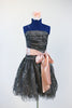 Dark grey dress with pewter lace overlay, has large pink sash and flower headpiece front
