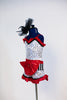 White and silver sequined shorts with black and white piano keys,red ruffles & a large red bow. Matching top with ruffle accent, black piping & black hairpiece, Side