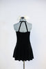 Black stretch velvet dress with attached panty has an ivory ruffled bib, black button and bow-tie accent. Comes with large, ivory bow, hair accessory. Back