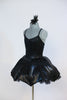 2 piece costume is black, leather-like fabric with a matching tutu type skirt with shaped boning  to a to create an umbrella effect with crystal raindrops. Done