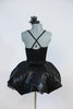 2 piece costume is black, leather-like fabric with a matching tutu type skirt with shaped boning  to a to create an umbrella effect with crystal raindrops. Back