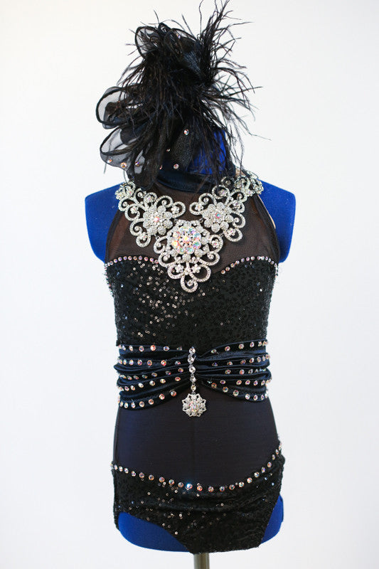 Black mesh bodysuit with crystals has waistband covered with 5 rows crystals and pendant. Entire chest is  large Swarovski necklace (gloves and hair piece).Zoomed