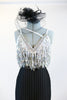 Black pin-stripe Zoot-Suit pant with a white/silver sequined &crystal bra that has fringe of dangling beads. Includes black headpiece and long gloves . Zoom front