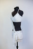 White velvet bra-top connected to white velvet short with crystal covered strap extending from the shoulder to opposite hip, that has white chiffon layers. Side