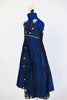 Long ballroom gown of navy iridescent taffeta, has halter-type neckline ,front brocade insert, crystal detail and pale pink appliqués. Has pink hair piece. Side