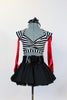 Striped, crop-top with neck-strap and short black, crinoline lined taffeta skirt, wide black patent leather belt, long red gloves and black bow headband. Front