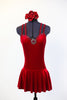 Deep red stretch velvet dress with attached bottoms. Criss-cross straps and Swarovski crystals with large center ruby coloured accent. Comes with hair piece. Front
