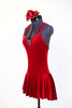 Deep red stretch velvet dress with attached bottoms. Criss-cross straps and Swarovski crystals with large center ruby coloured accent. Comes with hair piece. Side