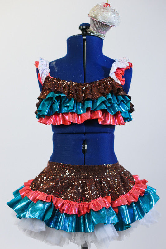 Turquoise-gold-coral sequined top has white ruffles & matching ruffled  sequined skirt with an attached panty. Has large cupcake hair piece with a cherry on top. Front zoom