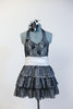 Black halter lace dress with attached panty has wide white stretch waistband and layered sequined skirt. Comes with matching black and white rose hair accessory. Front