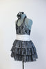 Black halter lace dress with attached panty has wide white stretch waistband and layered sequined skirt. Comes with matching black and white rose hair accessory. Side
