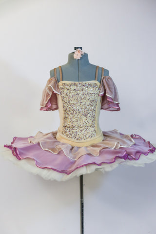 Professional ivory platter tutu, has rose/cream chiffon overlay and shoulder draping. Velvet bodice has gold sequined front. Comes with floral hair accessory. Front