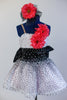 White base has crystal mesh overlay with a cascading spray of black velvet dots over white and  pink tulle. 2 coral daisies on bodice match the hair accessory. Front zoomed