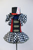 Black &White harlequin pattern dress has red/black sequined a bodice with crystal buckle accents and a large harlequin collar. With black top-hat 9 of hearts. Front with top-hat