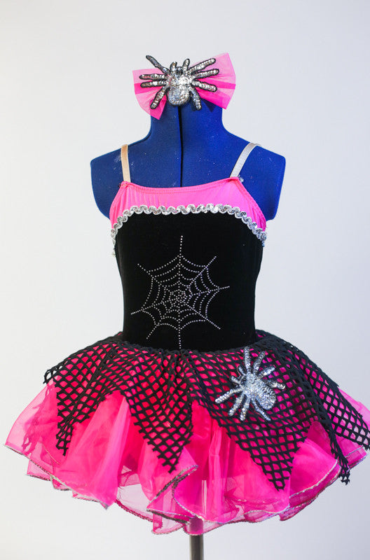 Black & pink leotard with spider-web, silver trim & spider applique. Comes with hot-pink  pull on skirt with black net  overlay & pink spider bow hair piece. Front zoomed