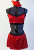 Red sequined bra top has black edging, criss-cross straps and a matching skirt with attacked black shorts. Comes with mini red jazz hat accessory. Front Zoom