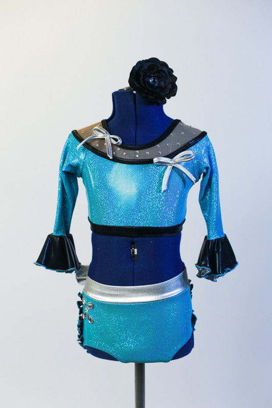 Turquoise half top has ¾ sleeves, mesh collar with crystals & silver bows. Bottom is panty/skirt with  black ruffles &  silver bow . Has matching head piece. Front