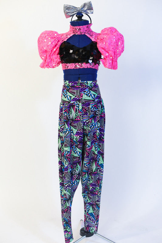 Black sequined half-top with neon pink high collar,pouff sleeves & open back with blackcorset ties. Comes with neon hip-hop harem pant & silver bow headband. Front